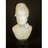 *Marble bust. A Victorian marble bust of a young gentleman, 26cm high, well carved on a green marble
