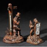 *Black Forest. An early 20th-century Black Forest desk thermometer, carved as a vagabond fox leaning