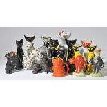 *Pottery cats. A collection of pottery cats including 1960s jugs modelled as seated cats, various