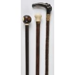 *Walking canes. An Edwardian walking stick with lignum vitae bowling ball knop with ivory insert