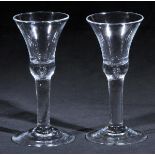 *Bell Glass. A fine pair of George II glasses, circa 1730-40, with drawn bell bowl, plain stem