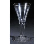 *Communal glass. A large George II communal glass, circa 1740, with drawn trumpet bowl, the stem