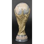 *World Cup. A Lladro porcelain model of the football World Cup trophy, after the design of