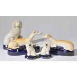 *Staffordshire. A pair of Victorian Staffordshire pottery pen rests modelled as recumbent