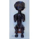 *Figure. An Ashanti tribe carved wood figure, carved as a female resting on a seat, 44cm high (1)