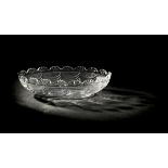 *Dish. A large George III glass dish, circa 1820, the body cut with falling swags, fan cut rim and