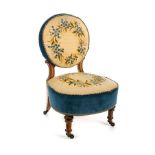 *Chair. A Victorian bedroom chair, light mahogany, fluted legs with brass castors, circular back and