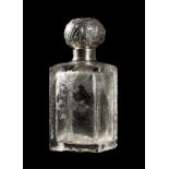 *Scent bottle. A 19th-century Continental silver top scent bottle, the square glass bottle with an