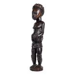 *Figure. A Baule maternity figure from the Ivory Coast, carved as a mother with infant on her