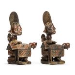 *Figures. A pair of Yoruba tribe "Offering" figures carved as a female and infant holding a