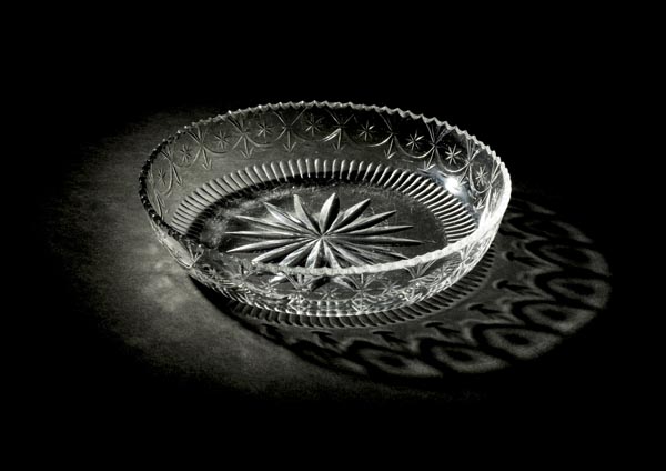 *Bowl. A George III Irish glass circular bowl, circa 1800, finely cut with stars and wavy rim,