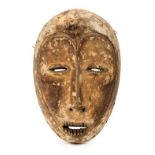 *Mask. A Lega tribe mask from the Congo, retaining white pigment, 26.5cm long (1)
