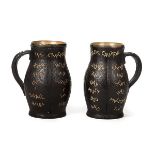 *Doulton Lambeth. A pair of Victorian Doulton Slater's Patent stoneware jugs, each in the form of