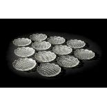 *Plates. A set of twelve George III glass ice plates, circa 1820, finely cut all over with