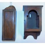 *Clock cabinet. A Victorian mahogany clock cabinet, the hinged door with arched decoration (possibly