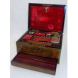 *Vanity box. A Victorian rosewood box by Fisher - 18 Strand, inlaid with brass, the hinged lid