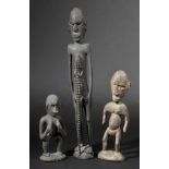*Melanesia. A Sepik River wooden figure, carved as a fully standing man with a lizard running up his