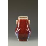 A CHINESE FLAMBE HU VASE, the rich red glaze pooling near the base and with some blue streaks, Qing,