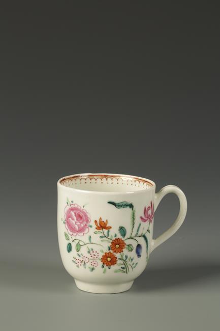 A WORCESTER COFFEE CUP painted in the Chinese famille rose style with flowers, the interior with