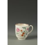 A WORCESTER COFFEE CUP painted in the Chinese famille rose style with flowers, the interior with