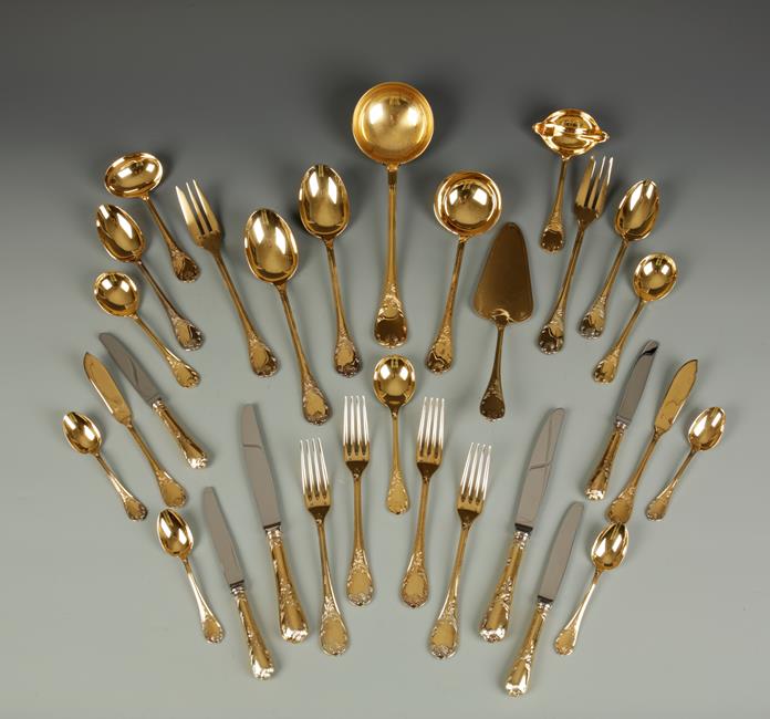 A CANTEEN OF CHRISTOFLE GILT METAL CUTLERY, settings for ten people. See illustration