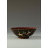 A CHINESE SANCAI SHALLOW BRINJAL BOWL decorated with flowers and foliage, Kangxi, 8.25" dia.