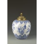 A CHINESE BLUE AND WHITE OVOID JAR decorated with flowers and foliage within lappet bands, Kangxi,