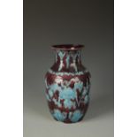 A CHINESE FAHUA STYLE BALUSTER VASE decorated in relief with flowers and ruyi motifs, Qing, 12"