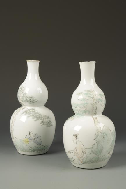 A PAIR OF CHINESE DOUBLE-GOURD VASES enamelled with scholars in a rocky landscape and calligraphy,