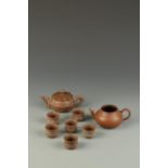 A CHINESE YIXING TEAPOT and six cups, of lotus form, signed Zhong-zuo, late Qing/Republic, the