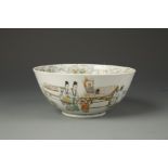 A CHINESE FAMILLE ROSE BOWL decorated with a continuous band of figures engaged in various