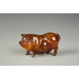 A CHINESE PRESSED 'AMBER' PIG, 20th century, 4" long