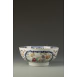 A CHINESE FAMILLE ROSE BOWL decorated with figure panels, Qianlong, 10" dia.