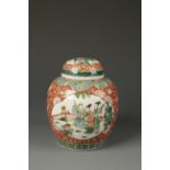 A CHINESE FAMILLE VERTE COVERED JAR decorated with panels of figures on a red ground, late Qing,