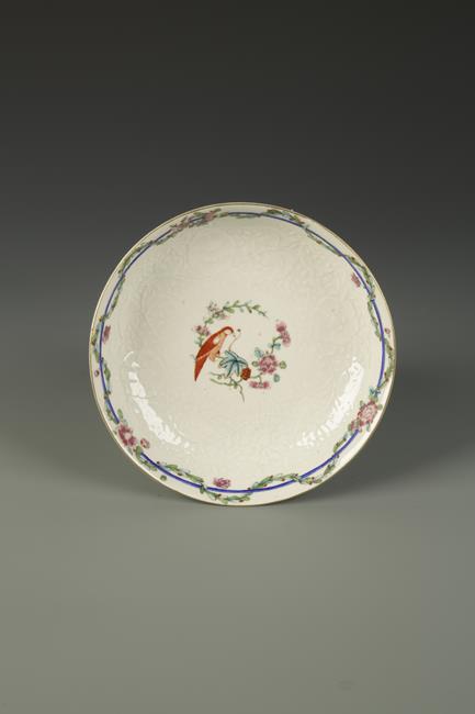 A WORCESTER SAUCER DISH painted in the Chinese famille rose palette, Old Worcester Parrot pattern,