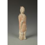 A CHINESE PAINTED POTTERY STANDING FIGURE wearing a red robe and with an articulated head,