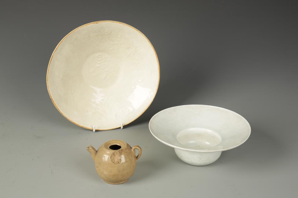 TWO CHINESE QINGBAI STYLE BOWLS, one of Zhadou form, 8" dia.; the other with moulded flower