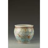 A CHINESE FAMILLE ROSE JARDINIERE decorated with a continuous narrative scene of warriors in a
