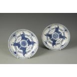A PAIR OF CHINESE BLUE AND WHITE SAUCER DISHES decorated with quatrefoil figure panels, Qing, 18th/