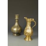 A PERSIAN BRASS/COPPER HOOKAH BASE AND A TURKISH EWER, the hookah base decorated with bands of