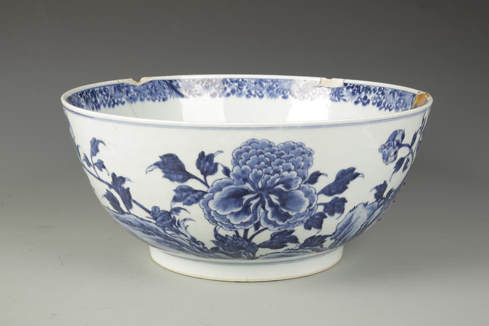 A LARGE CHINESE BLUE AND WHITE BOWL decorated with birds and flowers, Qing, 15.5" dia.