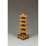 A CHINESE HARDWOOD SECTIONAL PAGODA, possibly huanghuali, the structure with five graduated tiers