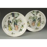 A PAIR OF LARGE CHINESE FAMILLE VERTE DISHES decorated with elegant ladies in garden landscapes,