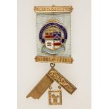 A SILVER GILT AND ENAMELED MASONIC JEWEL/MEDAL, Shenstonian Lodge No. 5544, with presentation