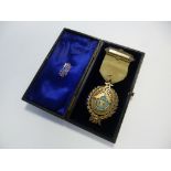 A SILVER GILT MASONIC JEWEL/MEDAL, Boscombe Lodge No. 2158, with presentation inscription, in