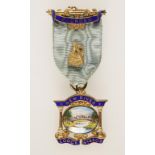 A SILVER GILT AND ENAMELED MASONIC JEWEL/MEDAL, New River Lodge No. 4502, with presentation