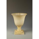 AN ART DECO ALABASTER UPLIGHTER with broad curving bowl, on a square base, early 20th century, 14"