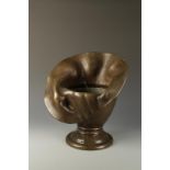 A LARGE BRONZE ART NOUVEAU LILY FORM JARDINIERE with broad splayed rim and circular base, 19" wide