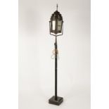 A "VENETIAN" LANTERN surmounted by a cross above stepped pierced borders and the lantern body, on