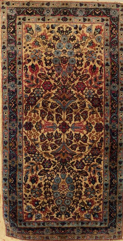 A SMALL PERSIAN RUG OF ISVAHAN TYPE, the ivory ground with a pale blue and red floral pattern,
